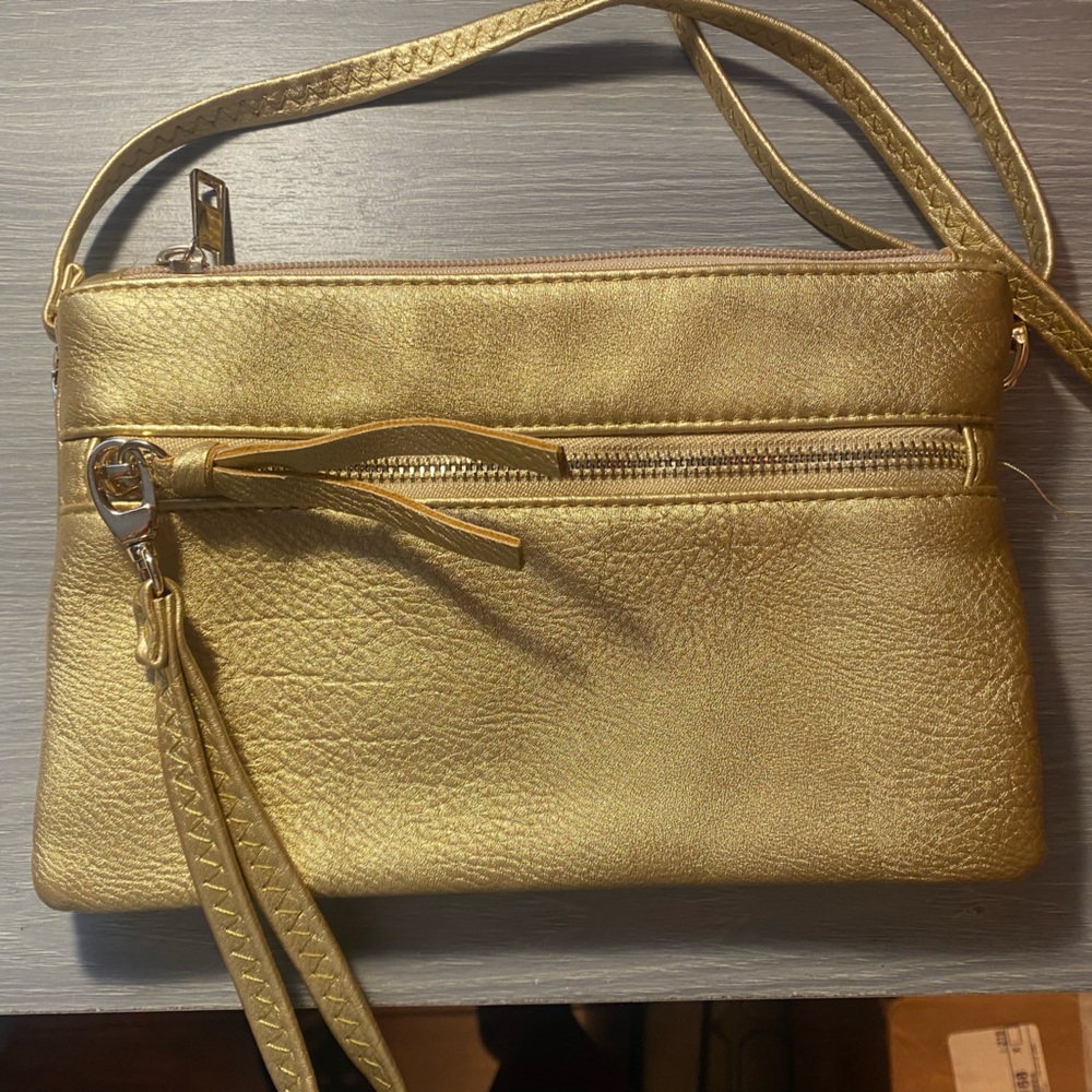 Beautiful gold wristlet/crossbody.